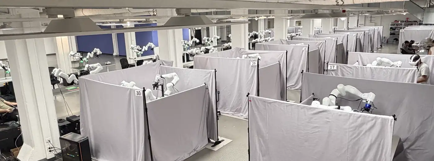 Rows of numbered, curtained benchmark stations used for evaluation.